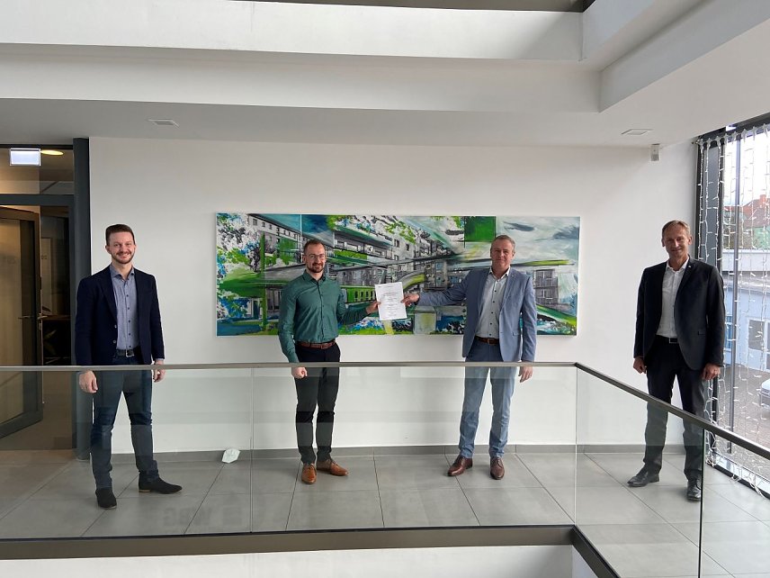 Bild: v.l.: Hr. Rollel, Hr. H&ouml;flich (beide Techem), Hr. Loup, Hr. D&ouml;rmann (beide WBG Vorstand)